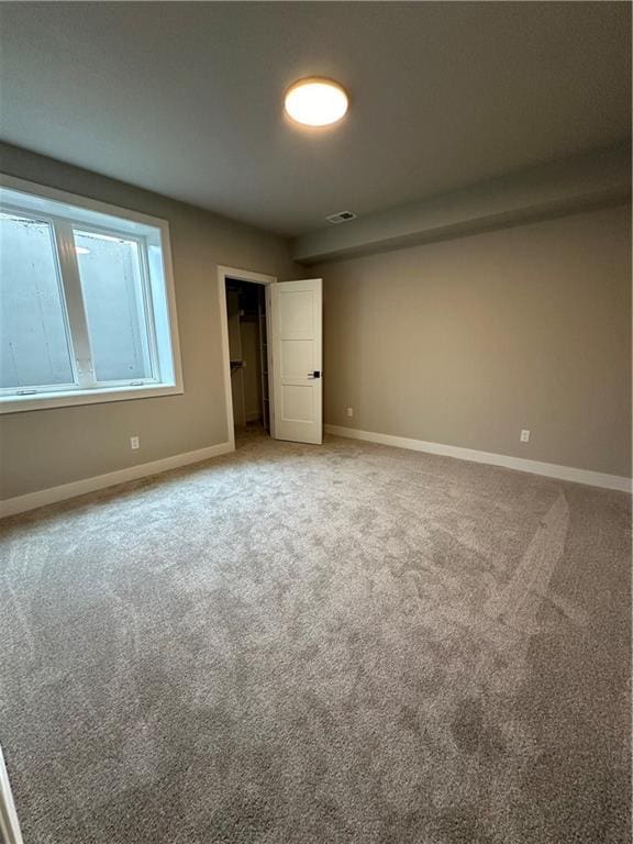 unfurnished bedroom featuring carpet