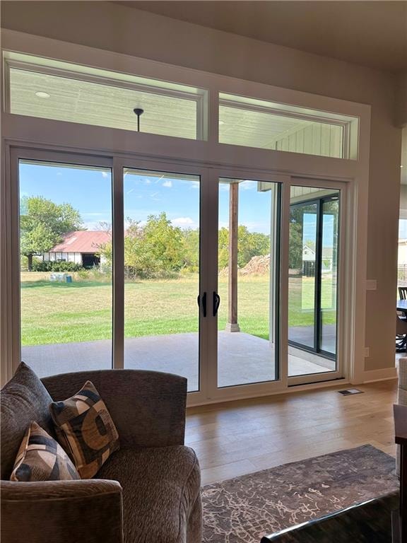 doorway to outside with hardwood / wood-style floors