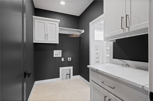 11522 S Zarda Dr, Olathe, KS 66061 - washroom with hookup for an electric dryer, washer hookup, cabinet space, and baseboards
