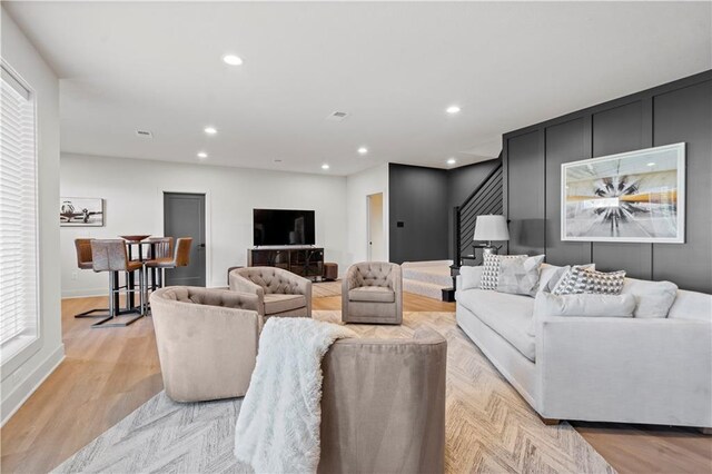 11522 S Zarda Dr, Olathe, KS 66061 - living area with recessed lighting, light wood finished floors, and stairs