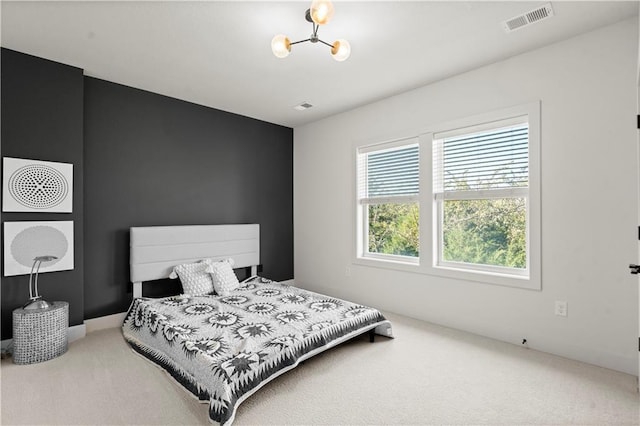 11522 S Zarda Dr, Olathe, KS 66061 - carpeted bedroom featuring visible vents and a notable chandelier