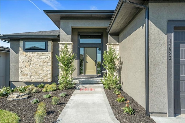 11522 S Zarda Dr, Olathe, KS 66061 - view of exterior entry featuring stucco siding and stone siding