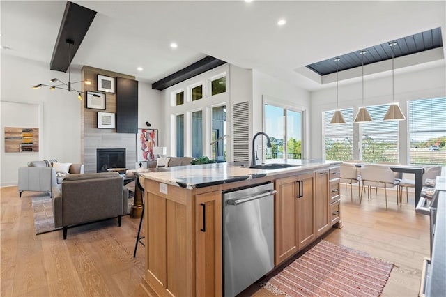 11522 S Zarda Dr, Olathe, KS 66061 - kitchen featuring light brown cabinets, stainless steel dishwasher, light wood finished floors, and a sink