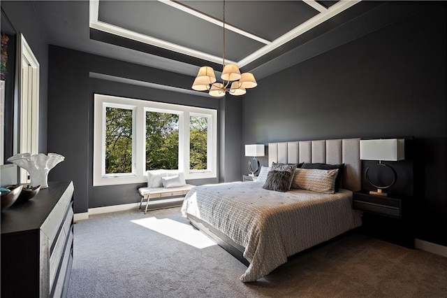 carpeted bedroom featuring a chandelier and a tray ceiling