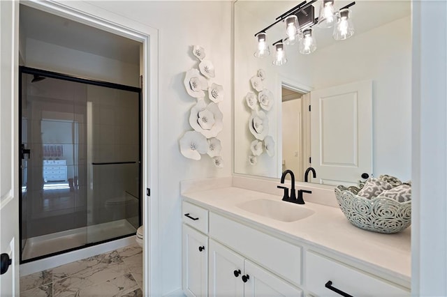 bathroom featuring an enclosed shower, tile floors, large vanity, and toilet