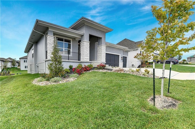 view of front of property with a garage and a front yard