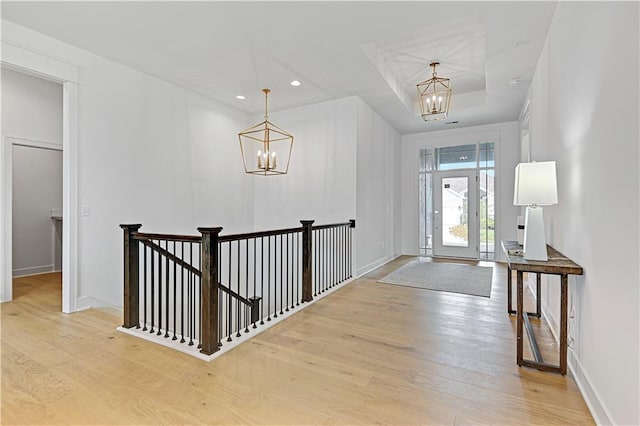 foyer featuring light hardwood / wood-style floors and an inviting chandelier