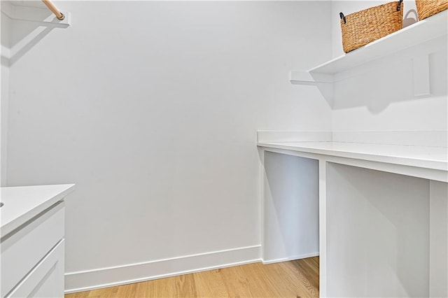 spacious closet featuring light wood-type flooring