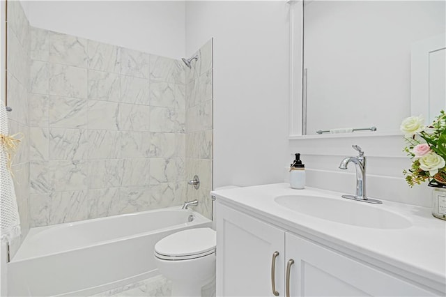 full bathroom featuring toilet, vanity, and tiled shower / bath combo