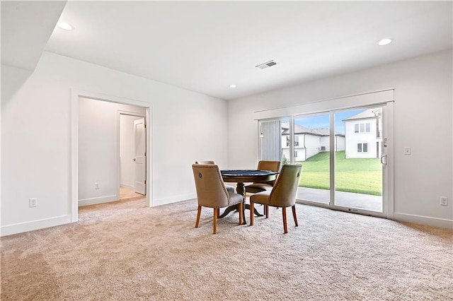 view of carpeted dining area