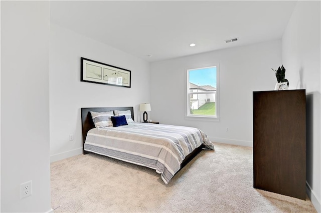 bedroom with light carpet