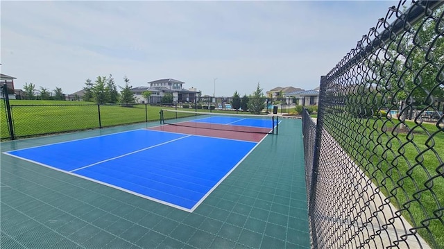 view of sport court with basketball hoop