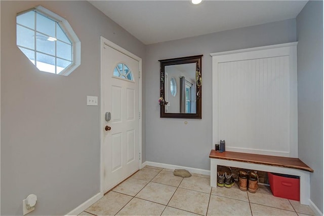 foyer entrance with light tile patterned floors