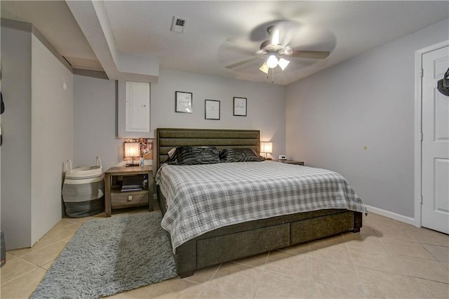 tiled bedroom with ceiling fan