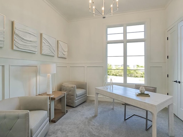 sitting room with light colored carpet, crown molding, and a chandelier