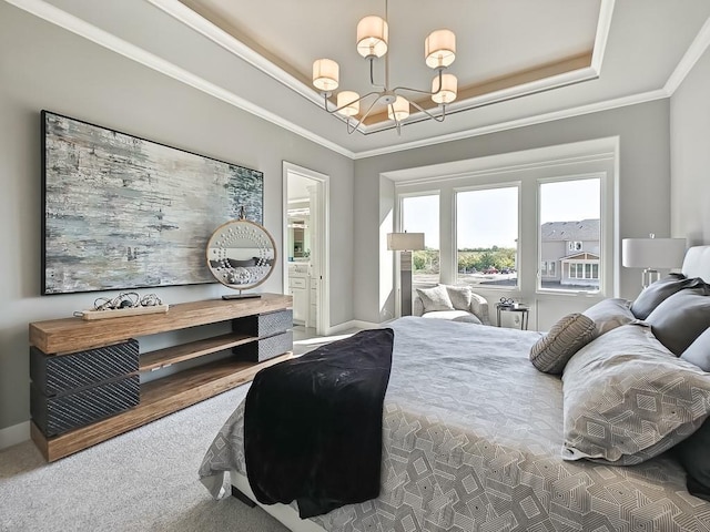 carpeted bedroom featuring a tray ceiling, crown molding, and an inviting chandelier