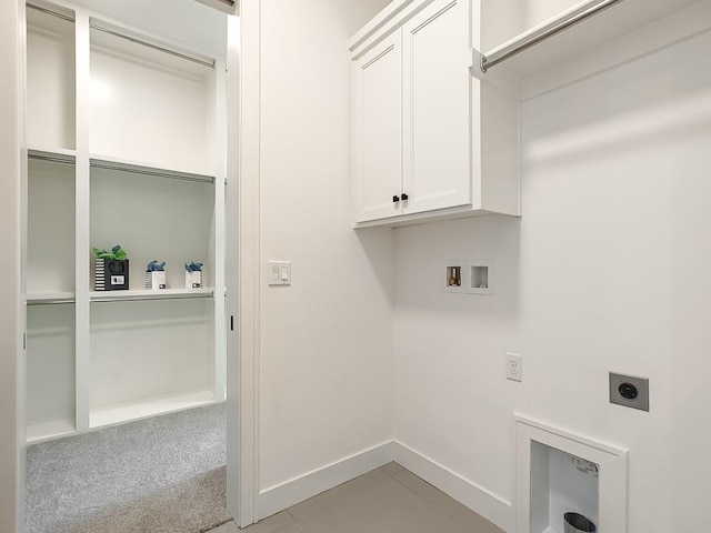 laundry area featuring hookup for a washing machine, light colored carpet, cabinets, and hookup for an electric dryer