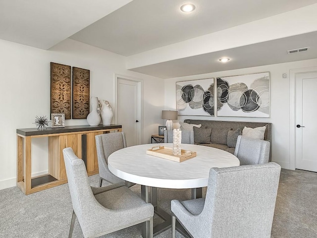 view of carpeted dining area