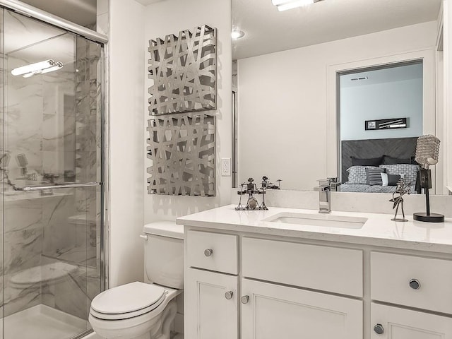 bathroom with vanity, toilet, and walk in shower