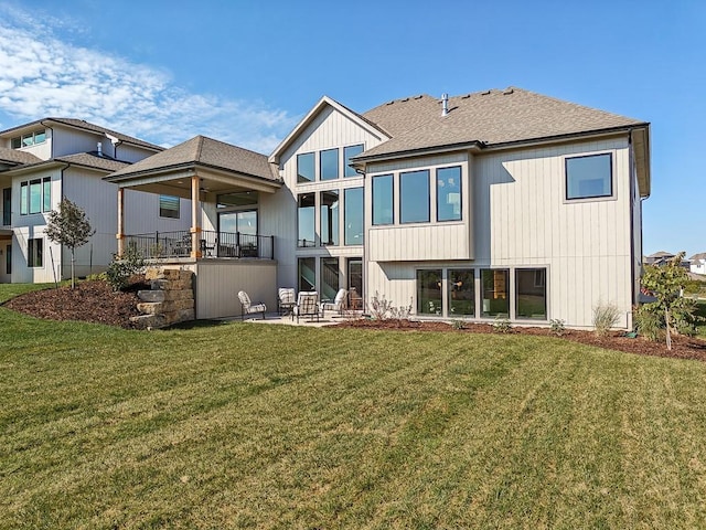 back of house featuring a yard and a patio