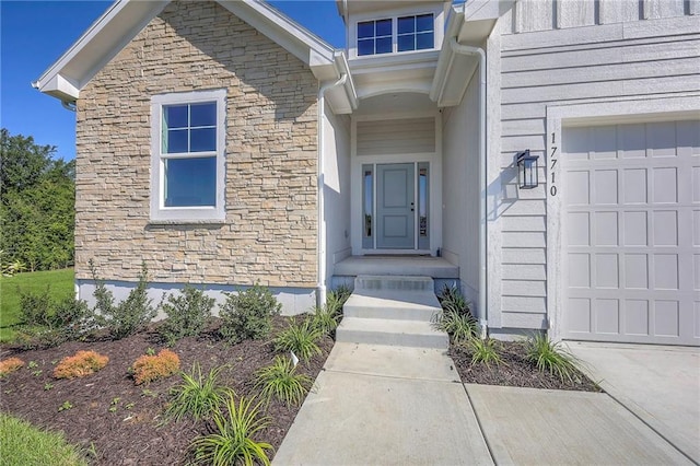 property entrance with stone siding