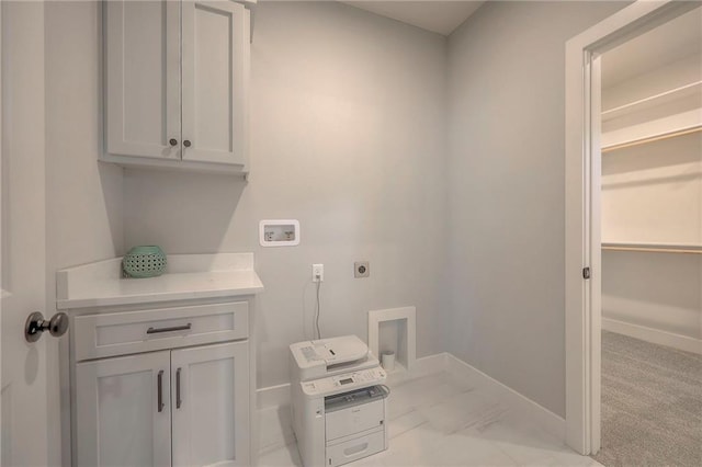 laundry area featuring cabinet space, electric dryer hookup, baseboards, and washer hookup