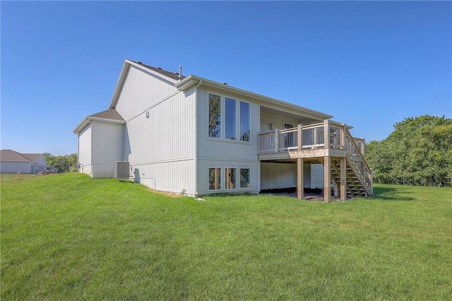 back of property with stairs, central air condition unit, a lawn, and a wooden deck