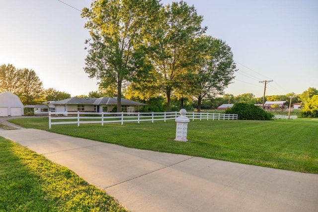 view of home's community with a lawn