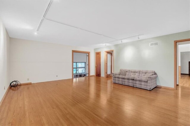 unfurnished living room with light wood-type flooring