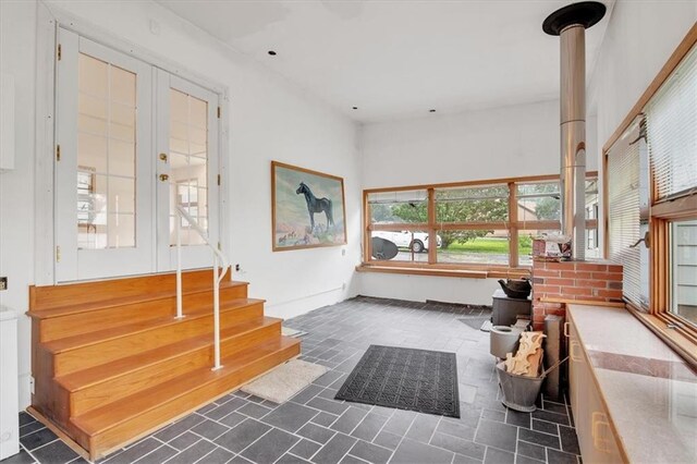 interior space featuring a wood stove and french doors