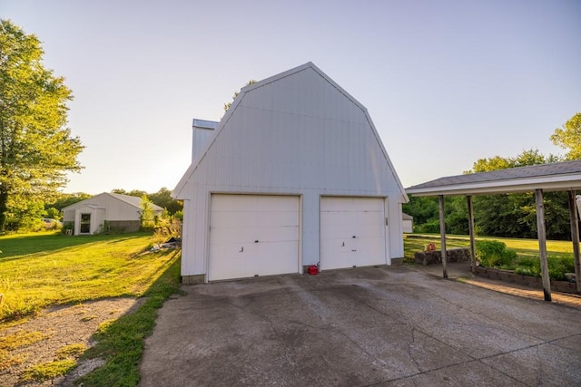 garage featuring a lawn