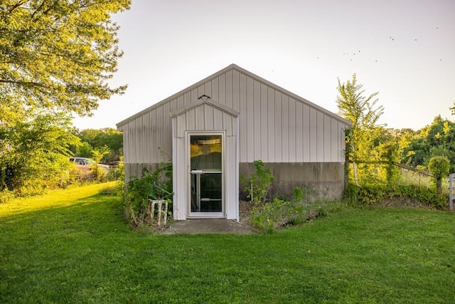 view of outdoor structure featuring a lawn