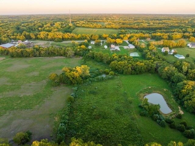 aerial view at dusk with a water view