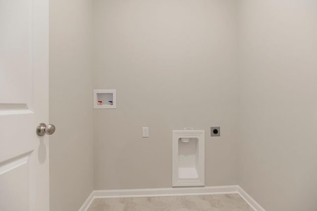 clothes washing area featuring electric dryer hookup, light tile patterned floors, and hookup for a washing machine