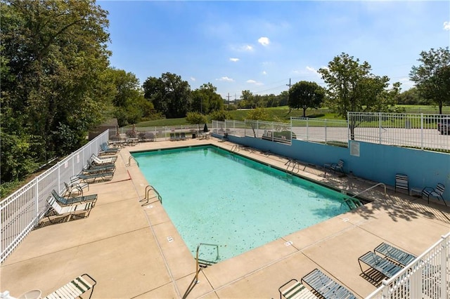 view of pool featuring a patio area