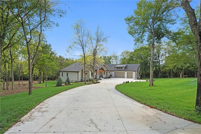 ranch-style home with a front lawn and a garage