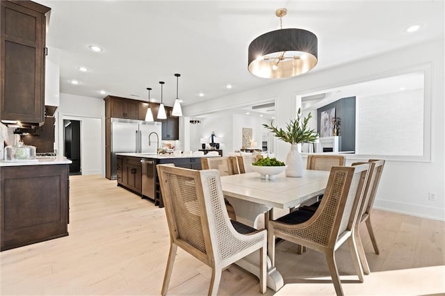 dining space with light wood-type flooring