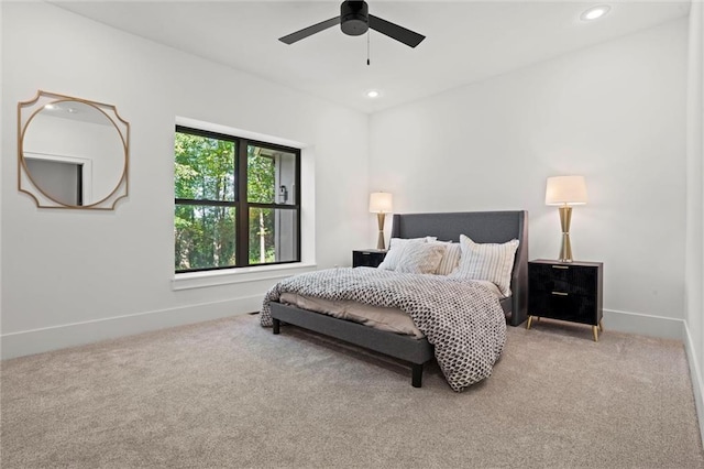 bedroom with ceiling fan and carpet floors