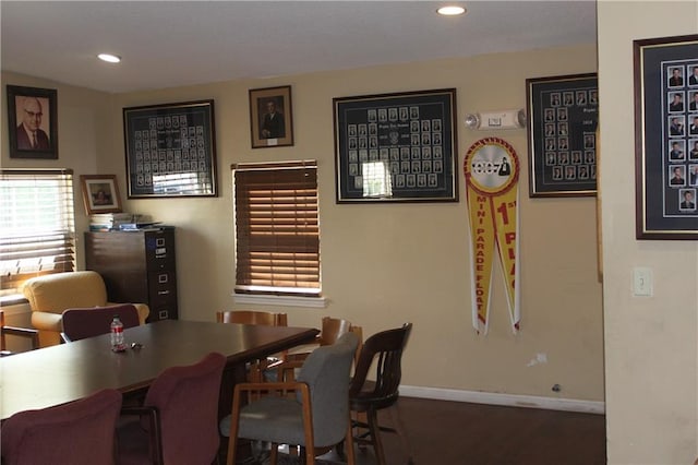 dining space with dark wood-type flooring