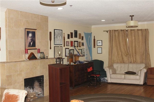 office area with dark wood-type flooring, a fireplace, tile walls, a textured ceiling, and crown molding