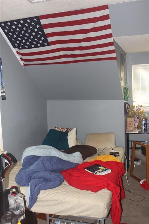 carpeted bedroom featuring vaulted ceiling