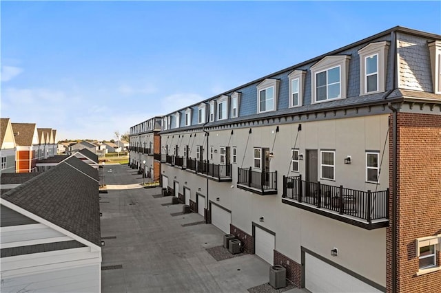 view of property featuring central AC unit