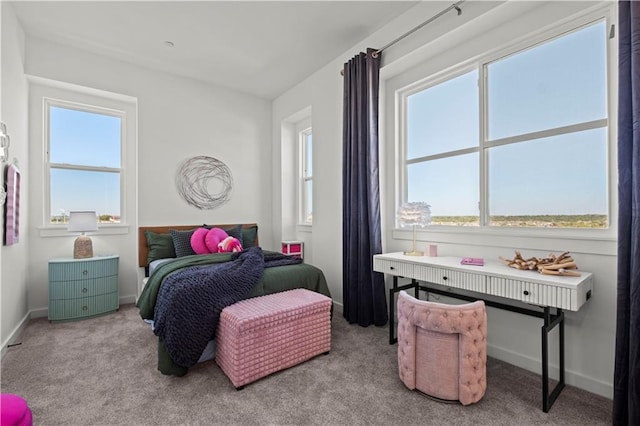 bedroom featuring light colored carpet