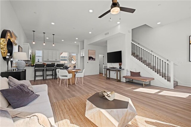453 SW Longview Blvd, Lees Summit, MO 64081 - living area with stairway, light wood-style flooring, a ceiling fan, recessed lighting, and baseboards