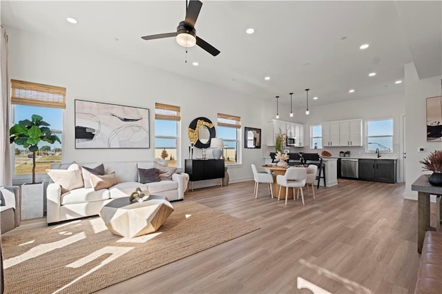 457 SW Longview Blvd, Lees Summit, MO 64081 - living room featuring recessed lighting, healthy amount of natural light, light wood finished floors, and ceiling fan