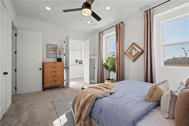 bedroom featuring ceiling fan and light colored carpet