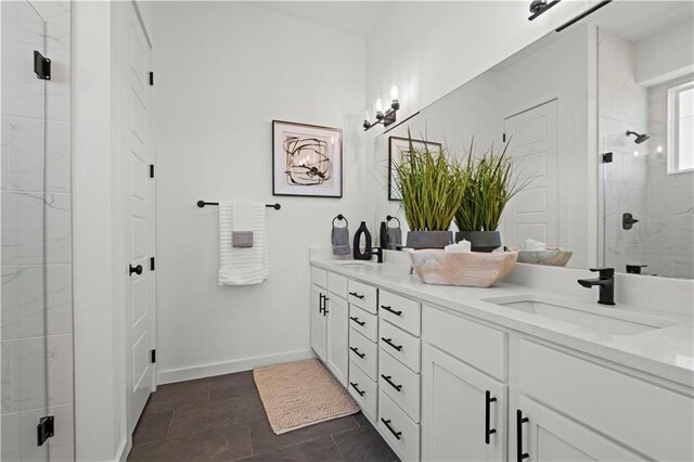 457 SW Longview Blvd, Lees Summit, MO 64081 - bathroom with double vanity, a shower stall, and baseboards
