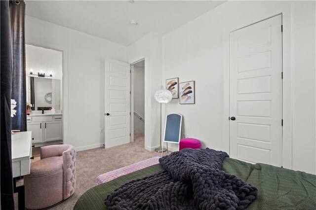 457 SW Longview Blvd, Lees Summit, MO 64081 - carpeted bedroom featuring ensuite bath and baseboards