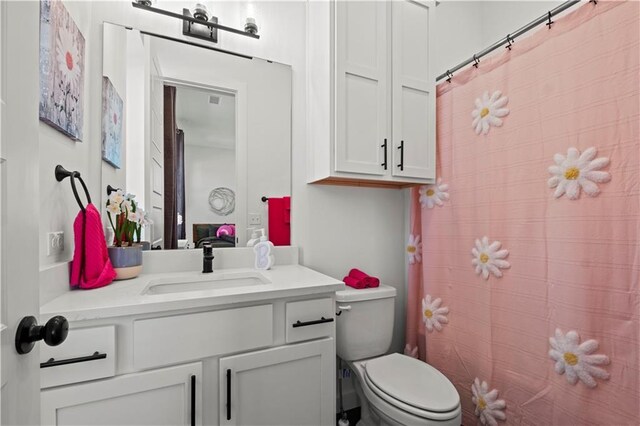 457 SW Longview Blvd, Lees Summit, MO 64081 - bathroom with toilet, vanity, and a shower with curtain
