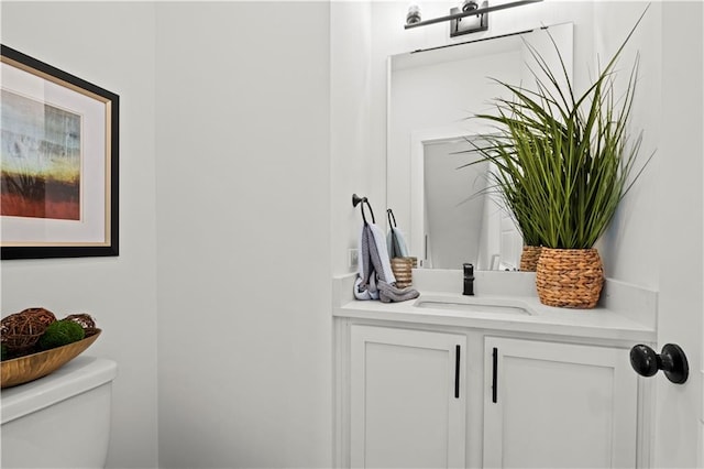 bathroom with toilet and vanity